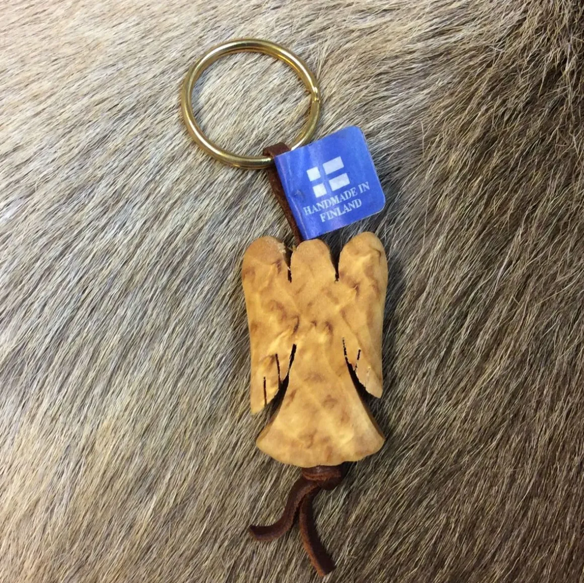 AVAIMENPERÄ VISAKOIVUISELLA FIGUURILLLA